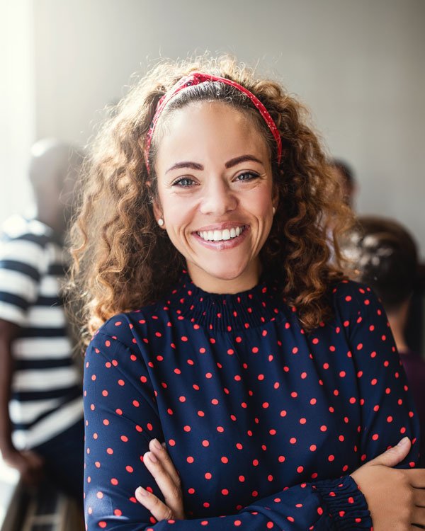 Smiling designer in an office with colleagues in t 7arx2jm.jpg